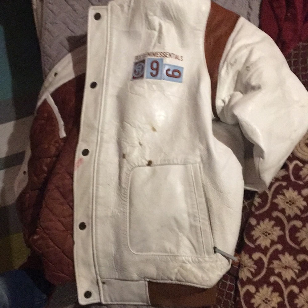 White and nice brown symbols and lining this is a genuine all real leather coat